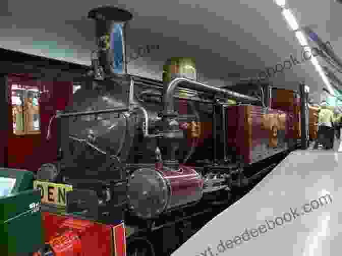 A Preserved Steam Locomotive On Display In A Railway Museum, Surrounded By Fascinated Visitors. Where Do Steam Trains Sleep At Night? (Where Do Series)